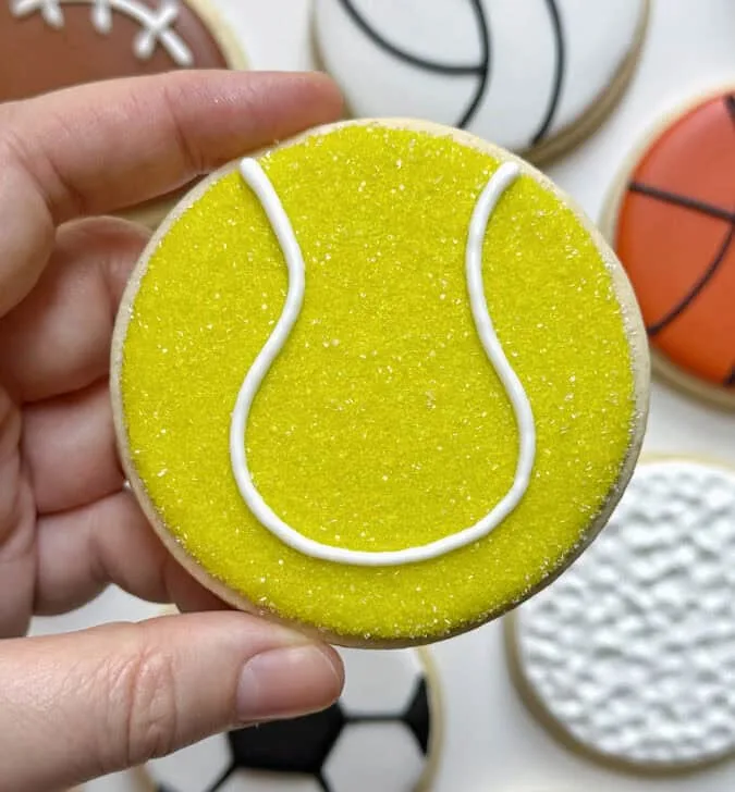 tennis ball cookie decorated with royal icing