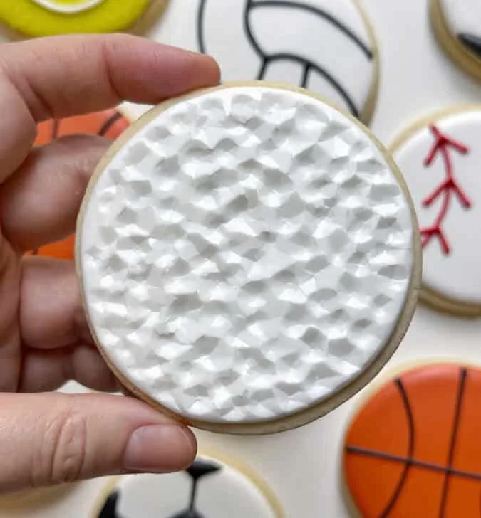 golf ball cookie decorated with royal icing