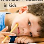kid lying on desk