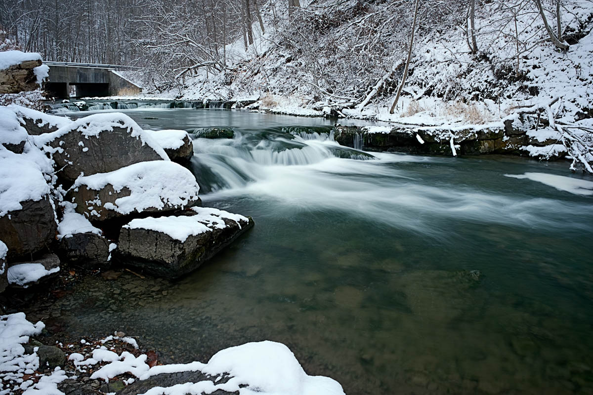 The contrasting tones of the newly fallen snow and the dark waters of Nine Mile Creek near Marcellus, New York.