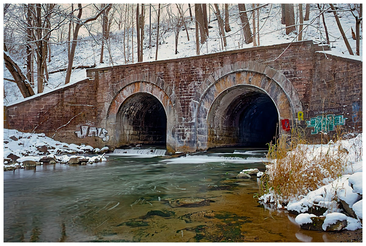 A stone and brick Railroad bridge built over Nice-mile Creek in Marcellus Falls, New York.