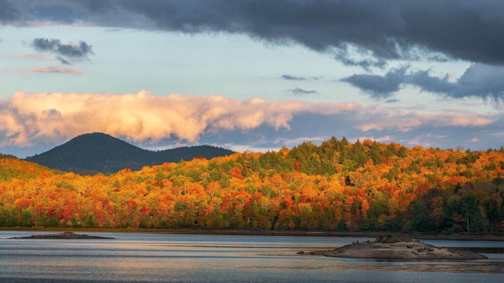 Setting sun on the eastern shore of Indian Lake in New York State