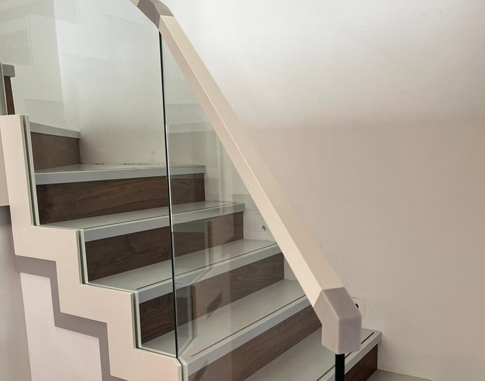 white frameless glass and aluminium banister