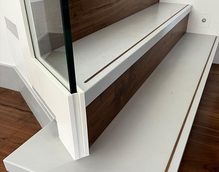 white frameless glass and aluminium staircase close up