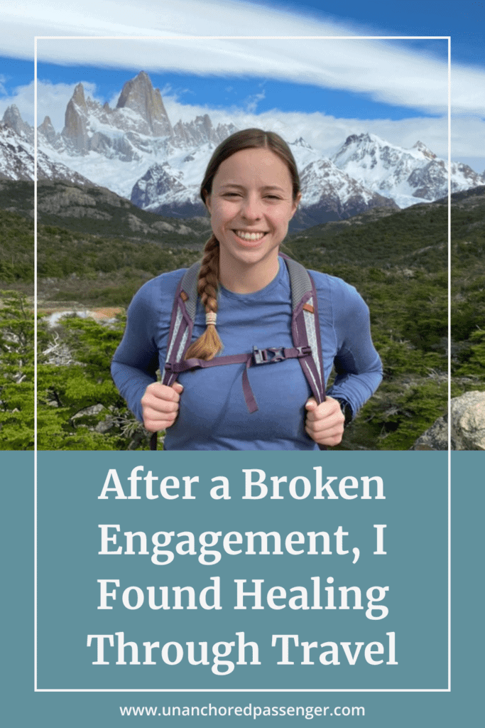 Woman smiling in front of mountains with text, "After a Broken Engagement, I Found Healing Through Travel" and "www.unanchoredpassenger.com"