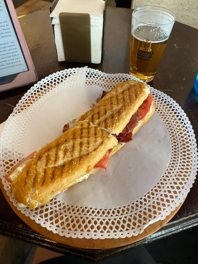 Large bocadillo sandwich and a beer in Pamplona.