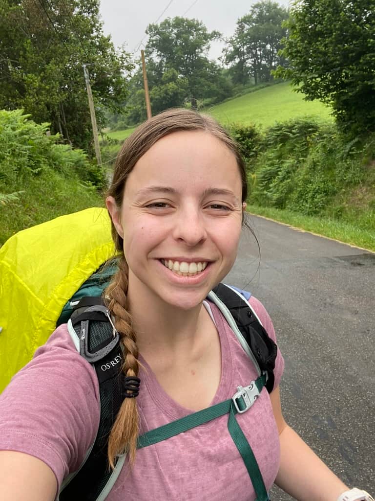 Mikala taking a selfie on a dreary morning, hiking alone on her first day on the Camino Francés.