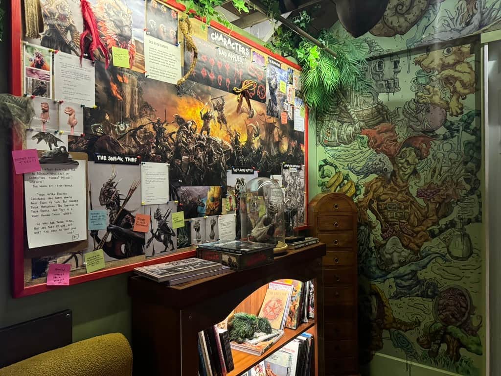 Wall at Wētā Workshop Unleashed in Auckland showing creative concepting art and notes to illustrate that process for visitors.