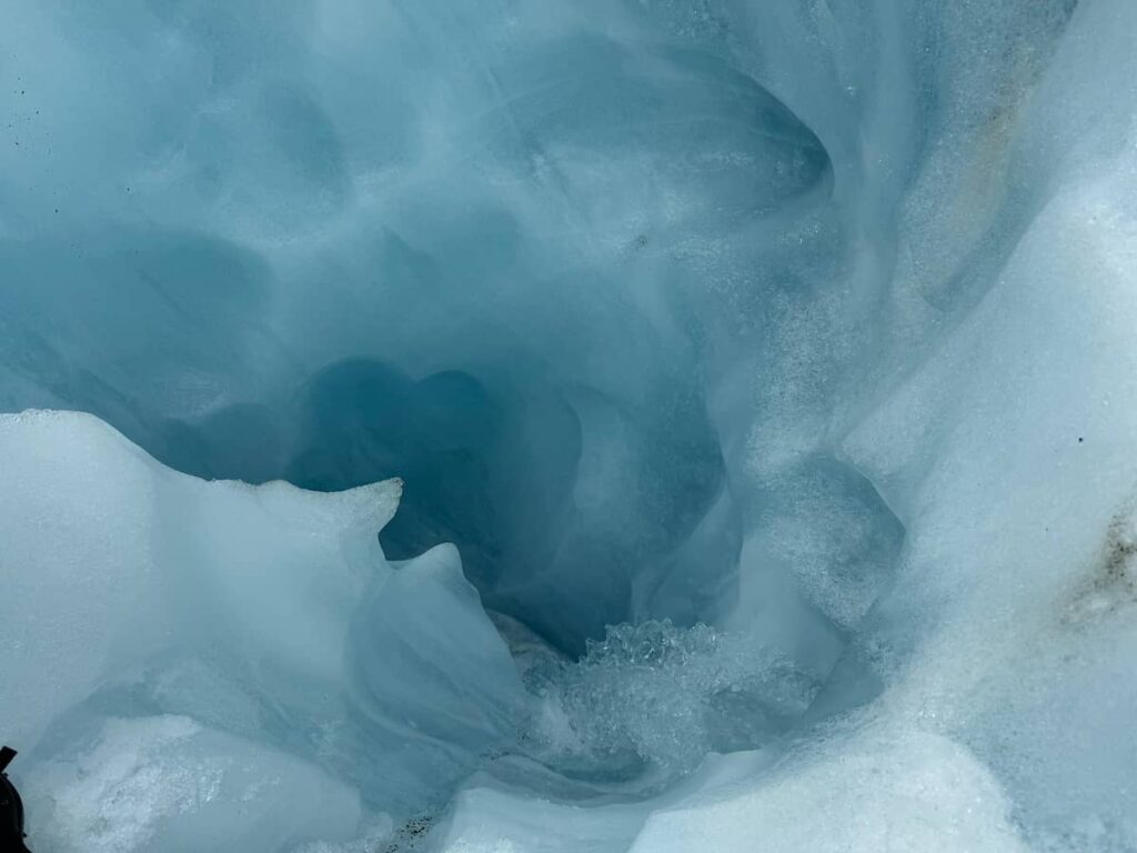 Meltwater carving out the ice.