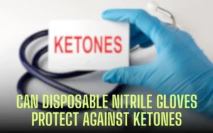 Hand in nitrile glove holds card reading "KETONES". Stethoscope in background.