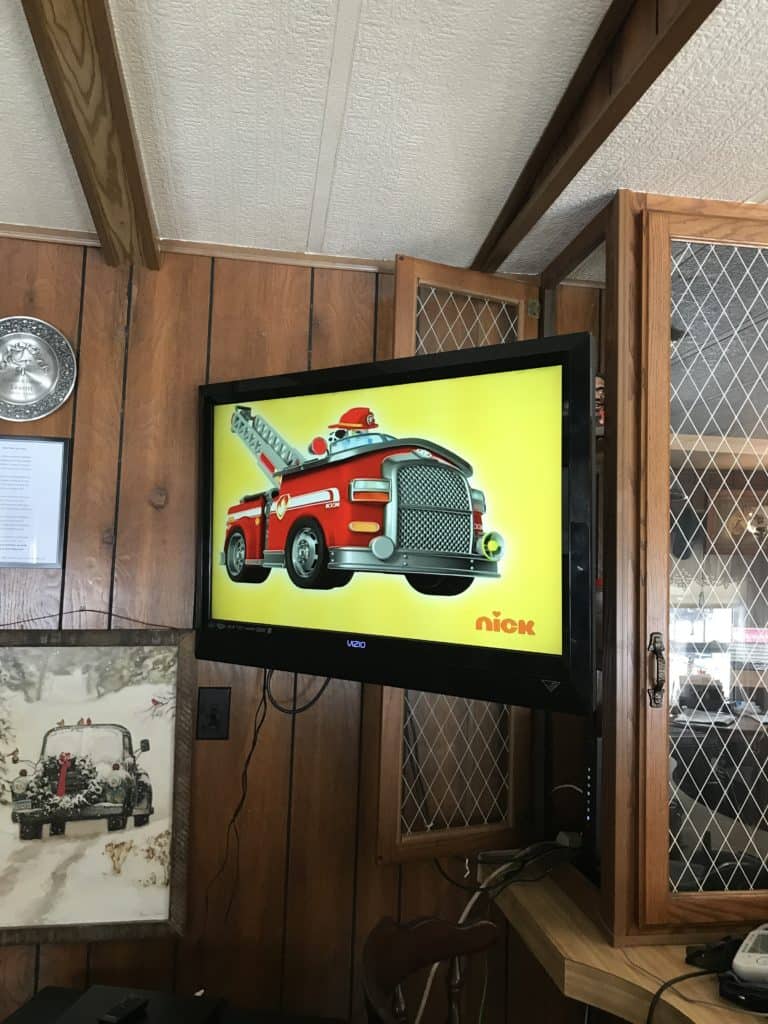 corner of mobile home with entertainment center before remodel