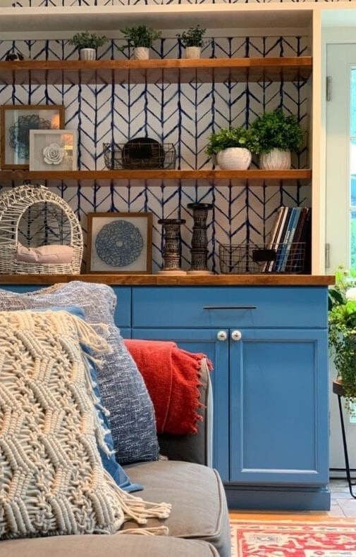 decorated shelves with wallpaper behind
