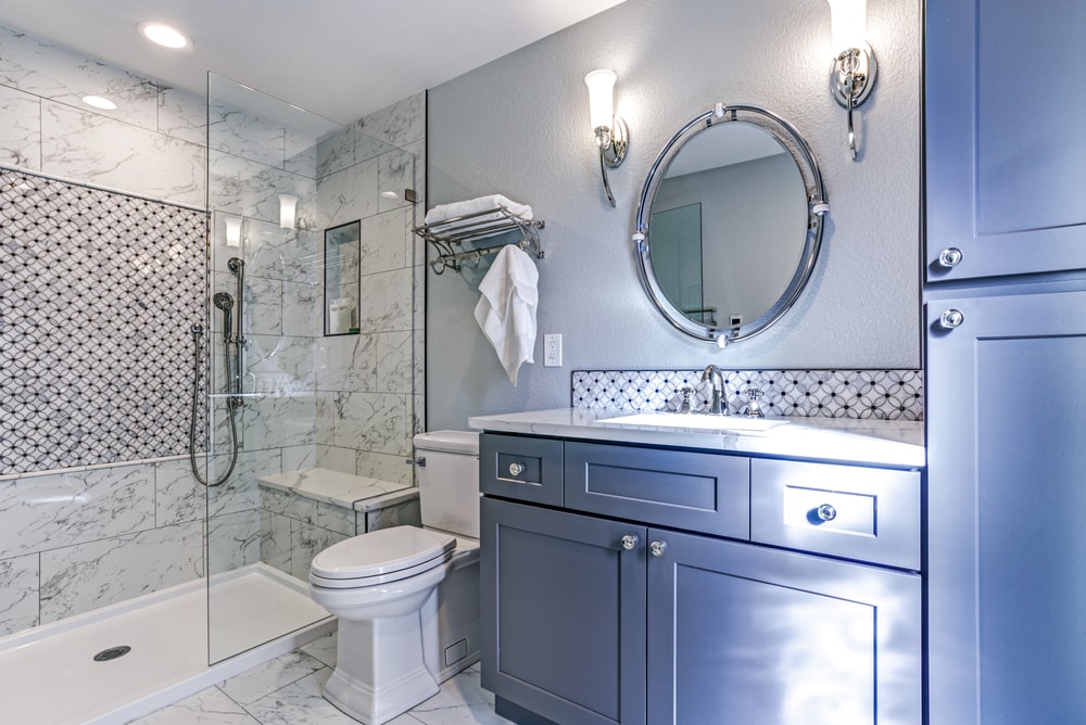 updated mobile home bathrooom in blue with walk-in shower