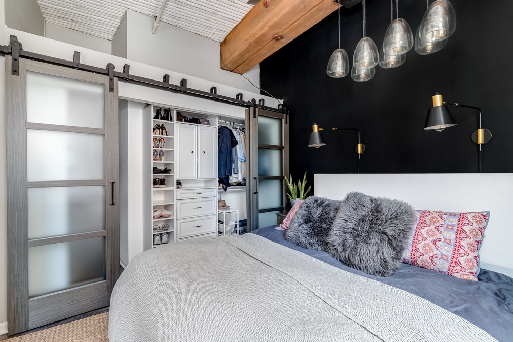 master bedroom with black accent wall as example to teach you how to choose an accent wall in your living room