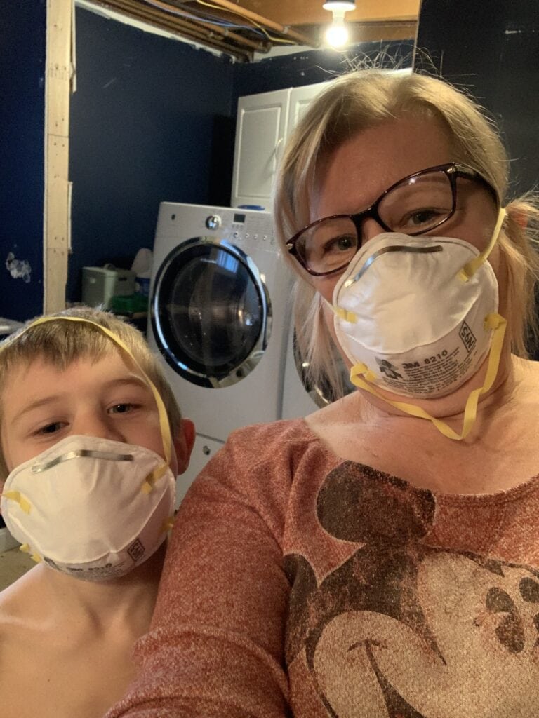 me and my grandson demoing the bathroom