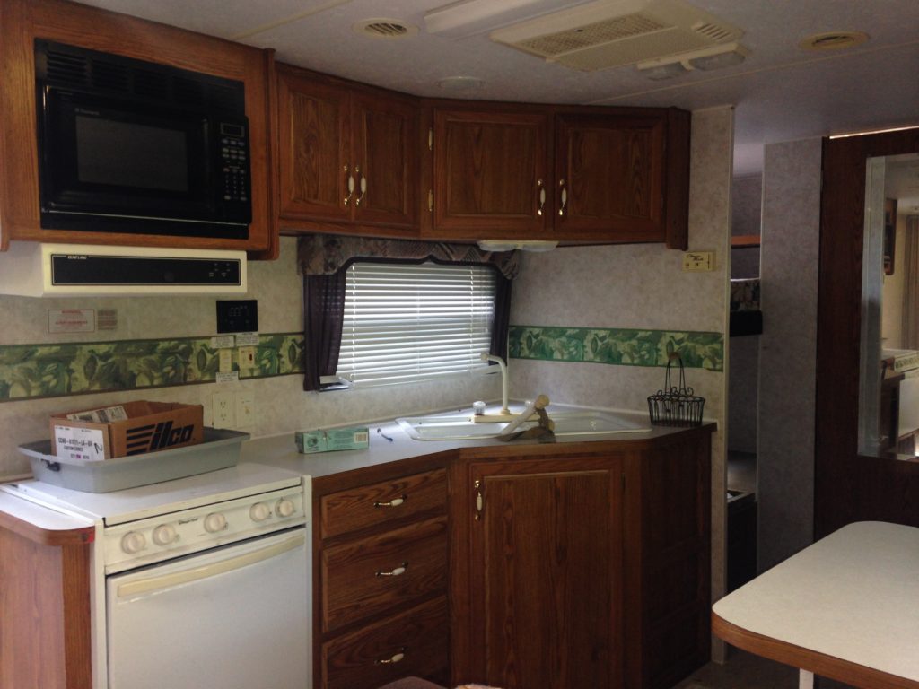 picture of our RV kitchen before it was torn apart.  Camper remodel before and after