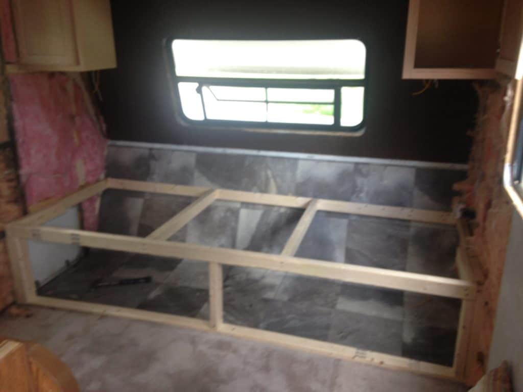picture of the framing of the storage area in our Camper remodel before and after