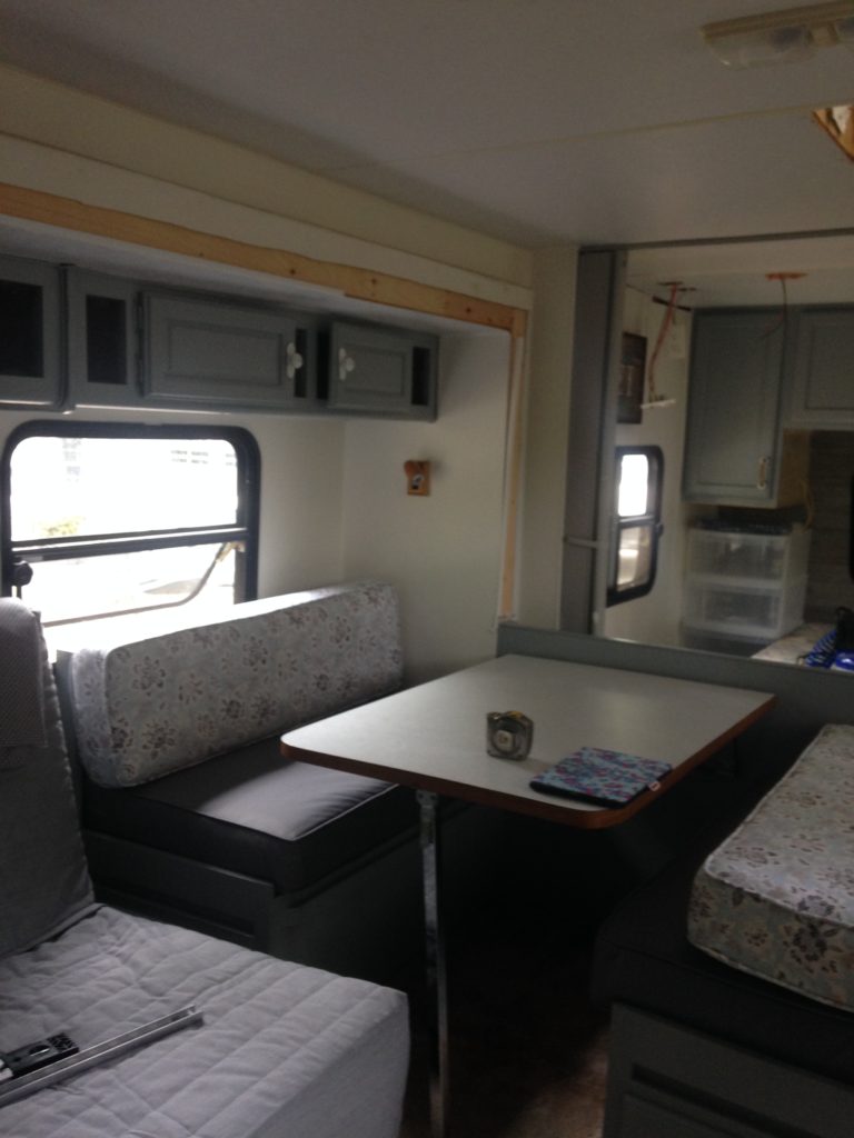 Picture of our banquet seating area in the camper after we moved the location.  Camper remodel before and after