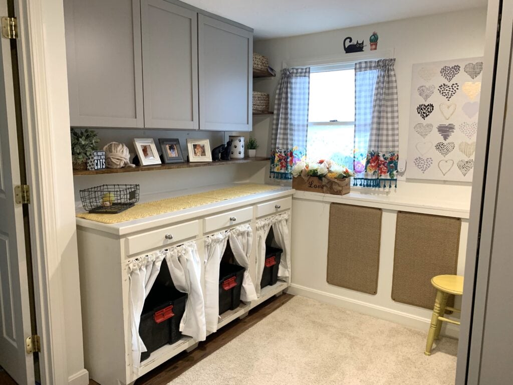 Cat room Ideas with litterbox cabinet and scratching wall
