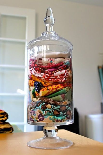 apothecary jar with scarves inside