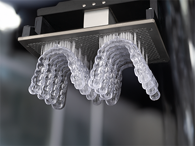 Eight clear dental splints printed on the PRO 20’s build platform using RS Crystal Polish