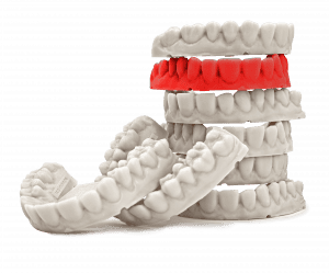 Image showing dental models with one red dental model