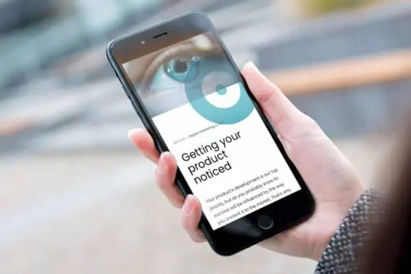 Mobile phone displaying a mobile optimised site design by web builders Wonderlab