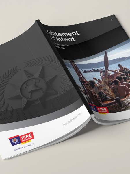 A black and white Fire and Emergency NZ brochure with a picture of a man on a boat.