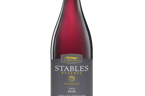 A bottle of Stables red wine on a white background.