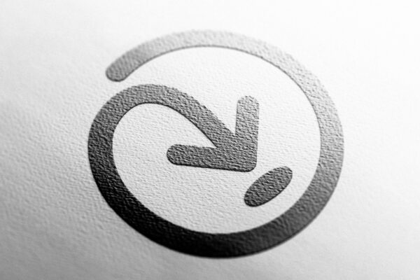 A black and white Addressfinder icon with an arrow on it.