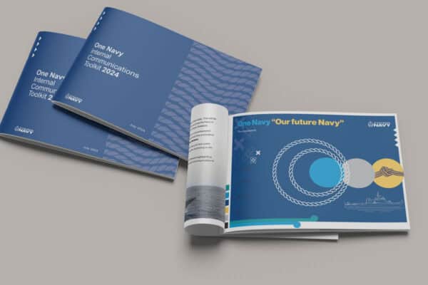 Three booklets with blue covers are displayed. Two are titled "One Navy Internal Communications Toolkit 2024," and the third is open, showing a page with the text "One Navy 'Our future Navy'" and marine-themed graphics. Navy logos are present.