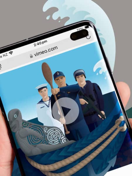 A hand holding a smartphone displaying an illustration of three sailors in an animated video on vimeo.com. The background shows a large wave, a lighthouse, and green hills. A carved grey figurehead of a waka and rope are visible at the bottom of the phone screen.