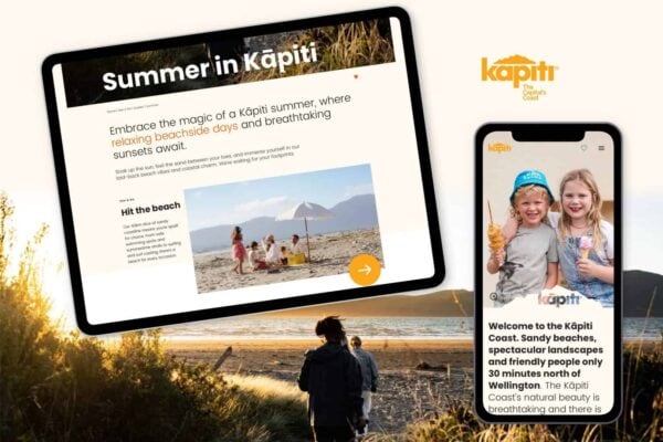 A tablet and smartphone display a travel website featuring "Summer in Kāpiti." The tablet shows a family at the beach, and the phone displays two children with ice cream. A background photo depicts people walking on a sunlit beach.
