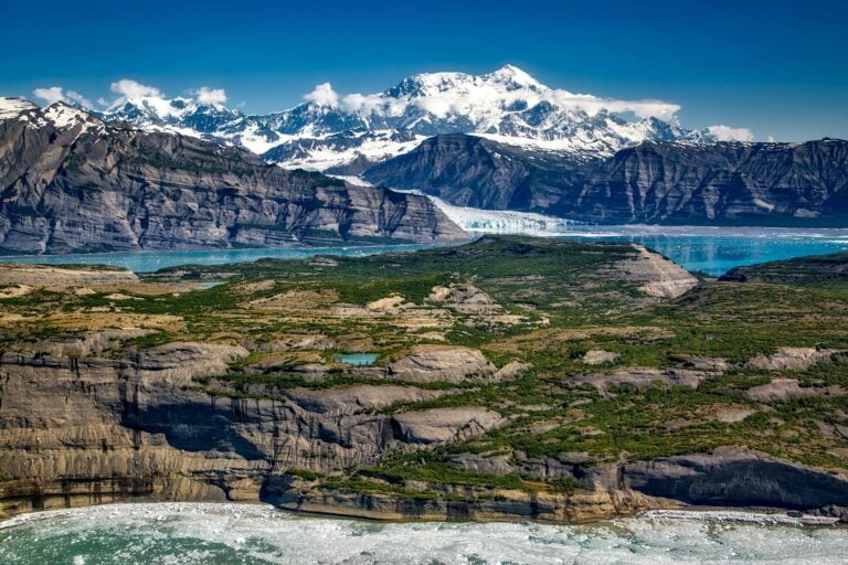 body of water in between mountains