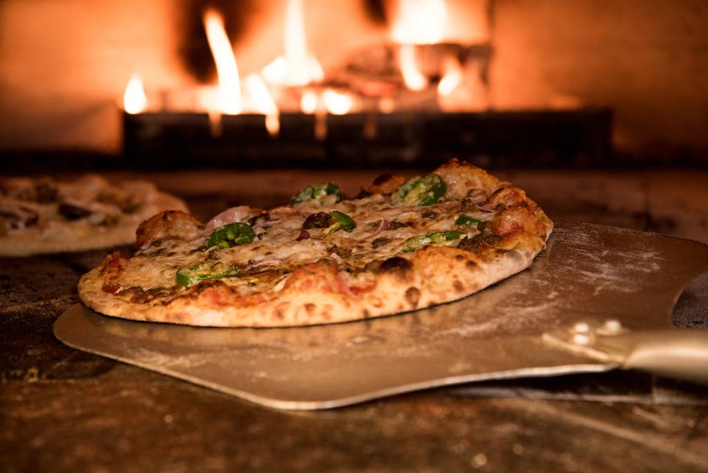 Baked Pizza on Pizza Peel in Oven