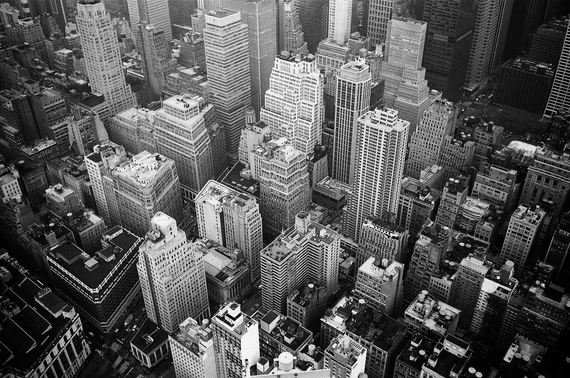 aerial view and grayscale photography of high rise buildings