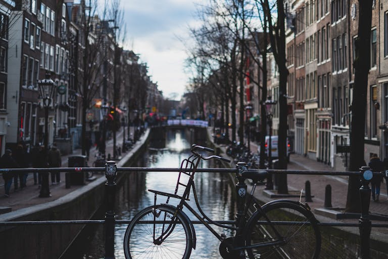 Bicycle Parked on a Bridge