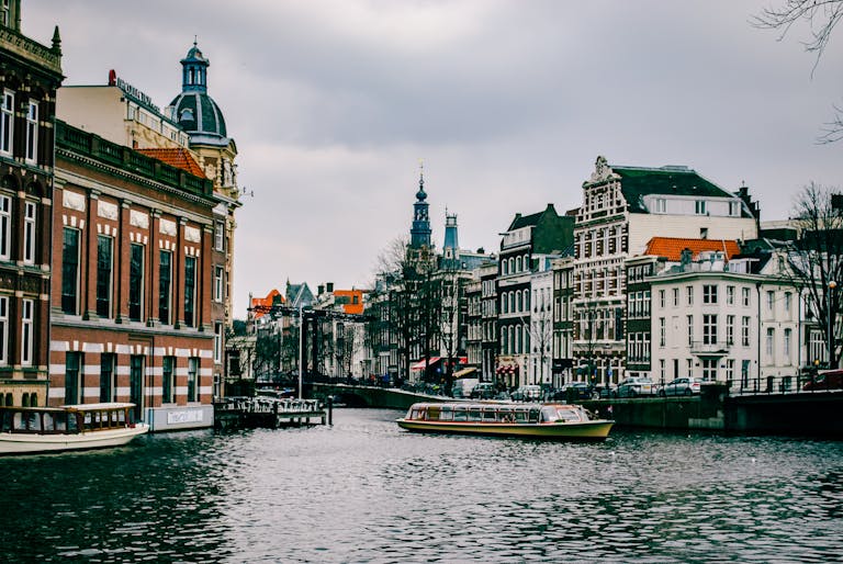 Boat On The Water Near Buildings