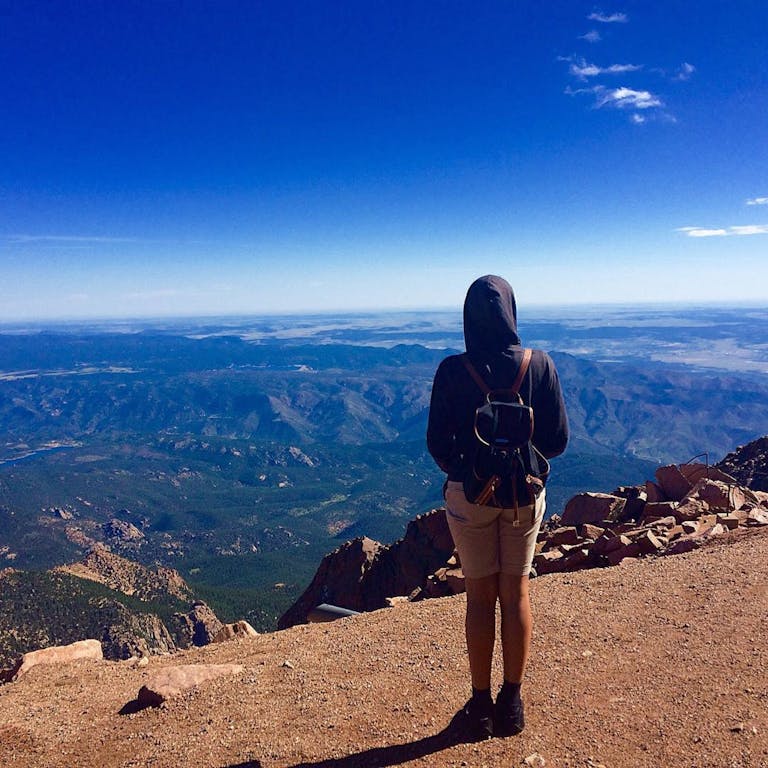 Person Wearing Black Hooded Jacket Staring on Landscape