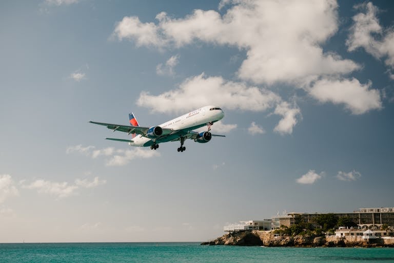 An Airplane Over the Sea