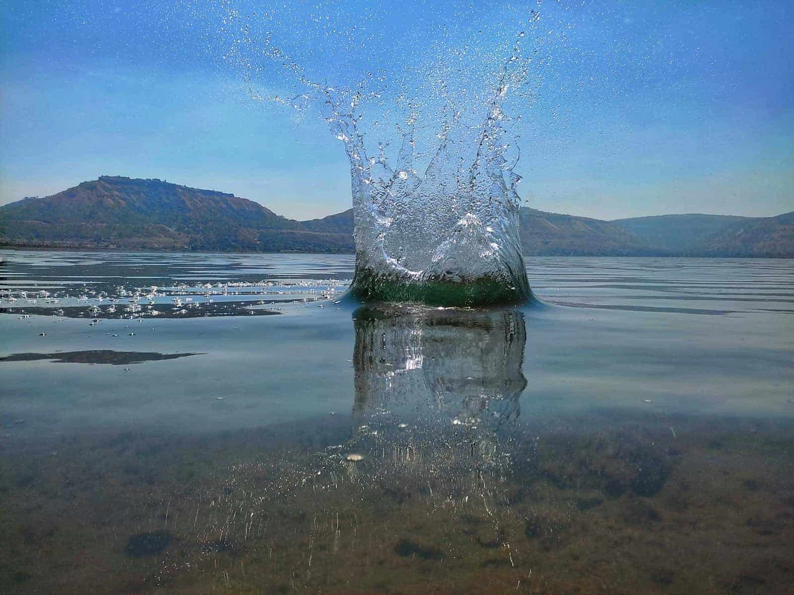 Explosive surface splash on a lake when fish suddenly start feeding hard