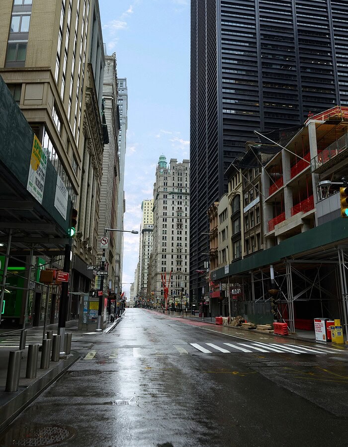 Empty wet Broadway street in Lower Manhattan during the COVID pandemic.