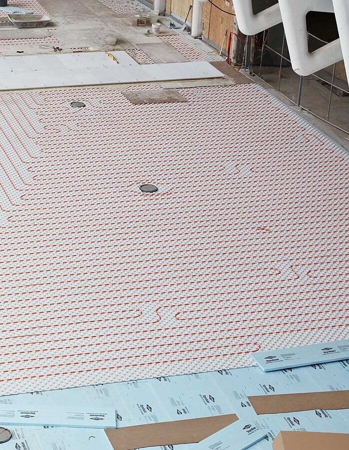 Radiant heated flooring system being installed inside the World Trade Center Oculus before public opening.