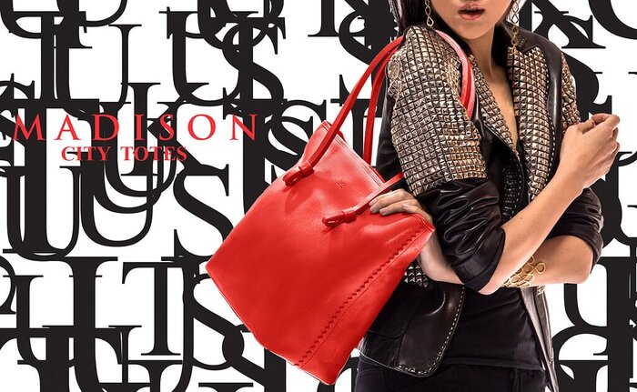 Fashion model holding a red leather tote bag against a graphic Madison City Totes layout.