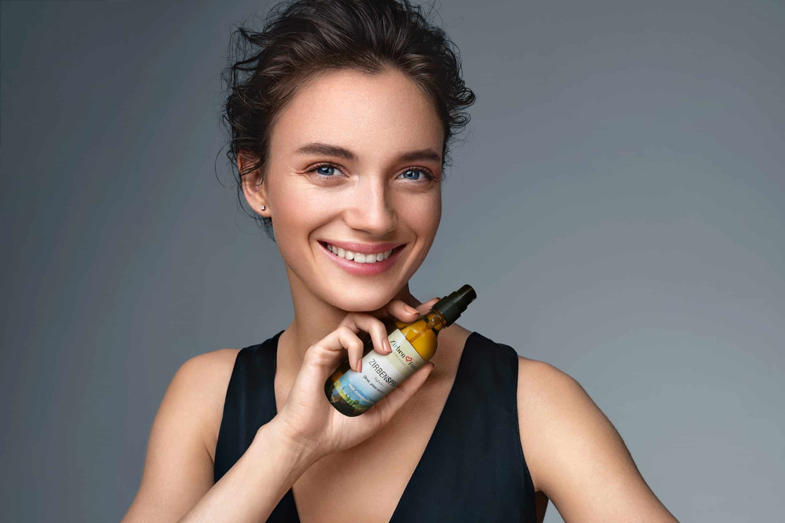 Woman with finishing spray