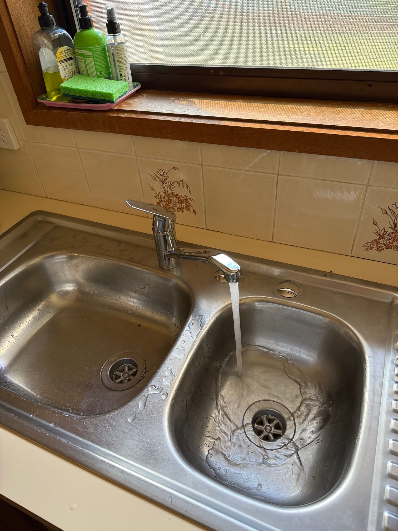 Alternate angle of new flick mixer running water in Lyneham kitchen.