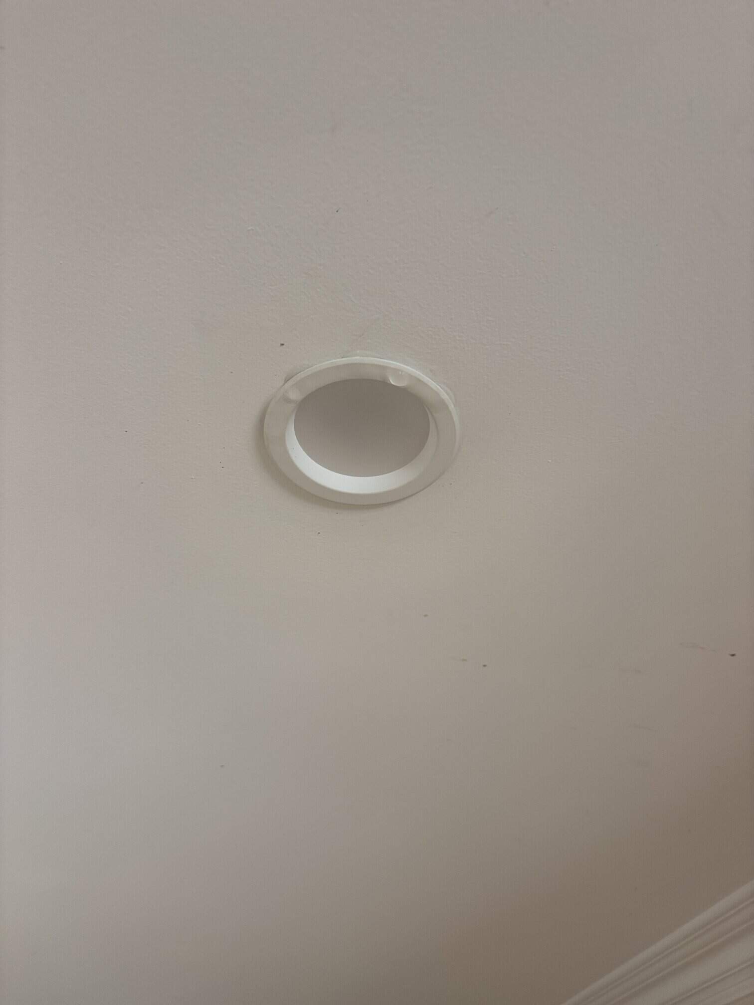 Damp gyprock ceiling showing water ingress around light fitting in Red Hill