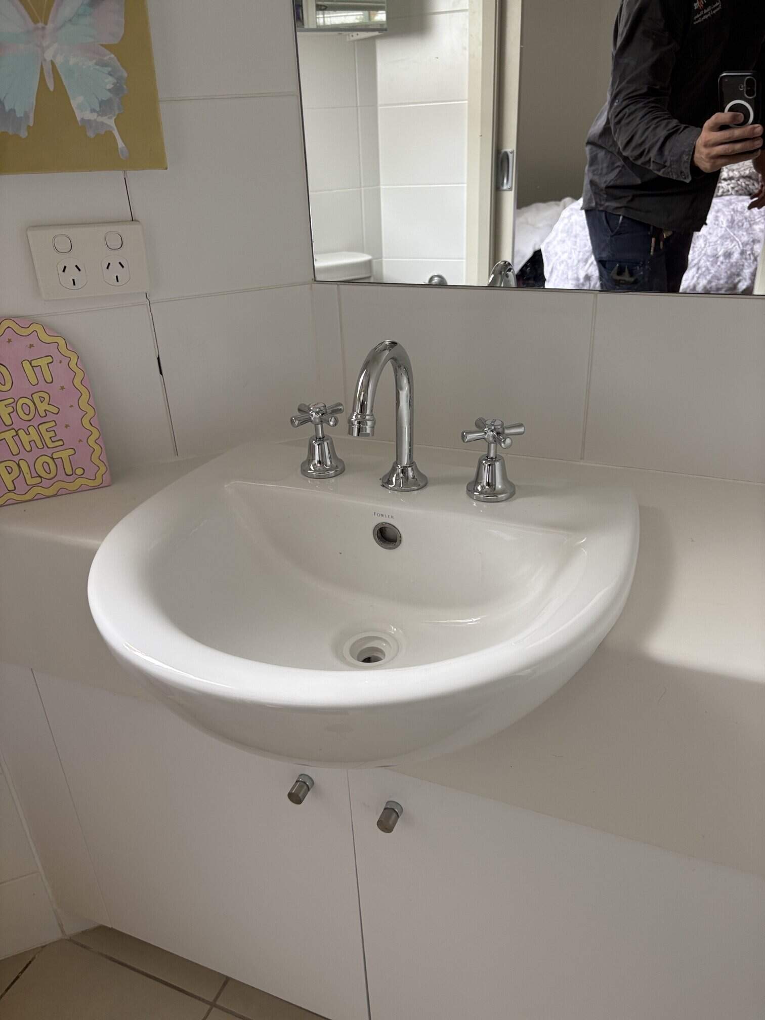 Water Tight Canberra plumber Brayden installing new basin tap set in Griffith ACT.