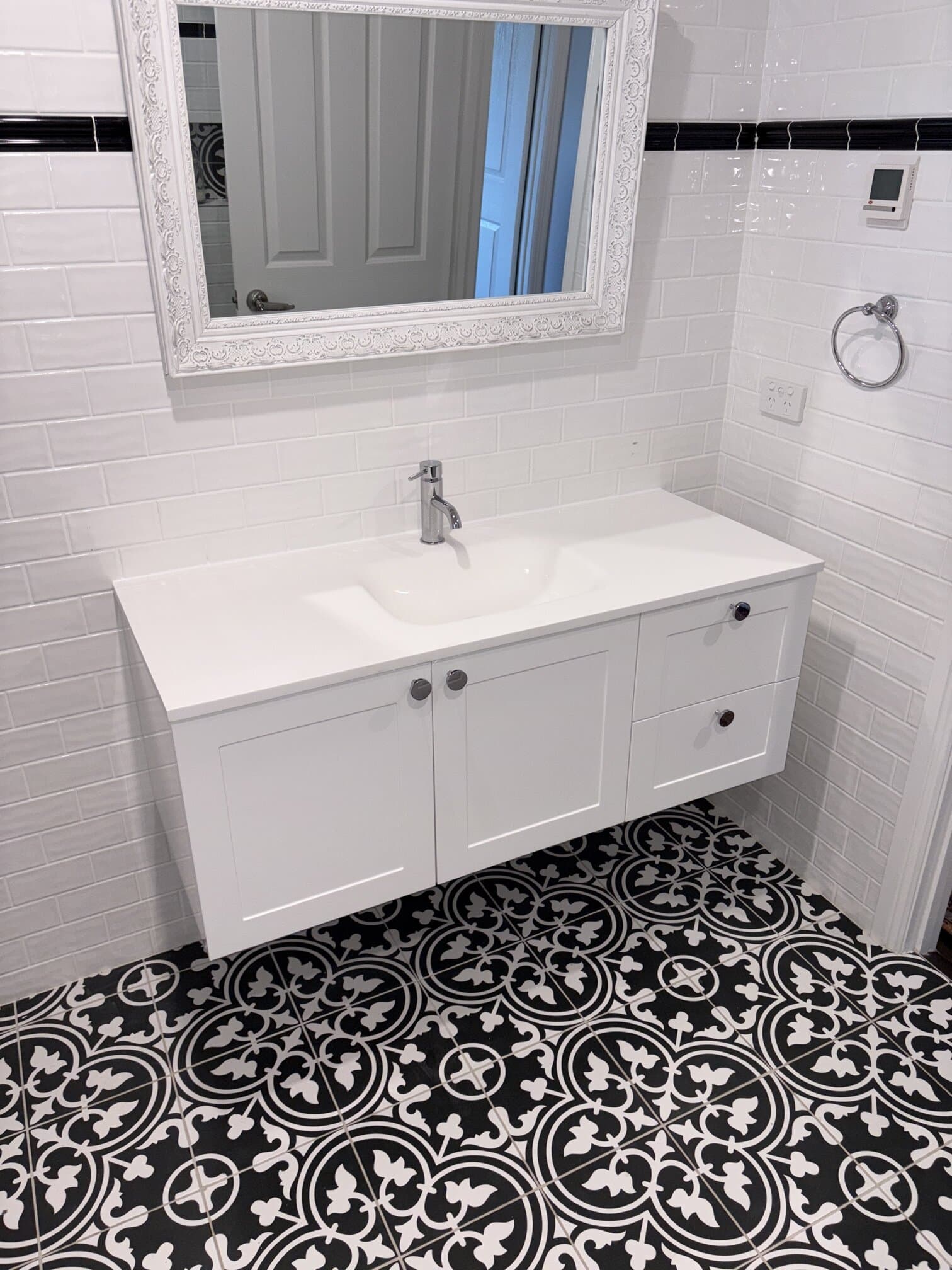 Water Tight Canberra plumber Brayden installing a new bathroom vanity in Red Hill ACT