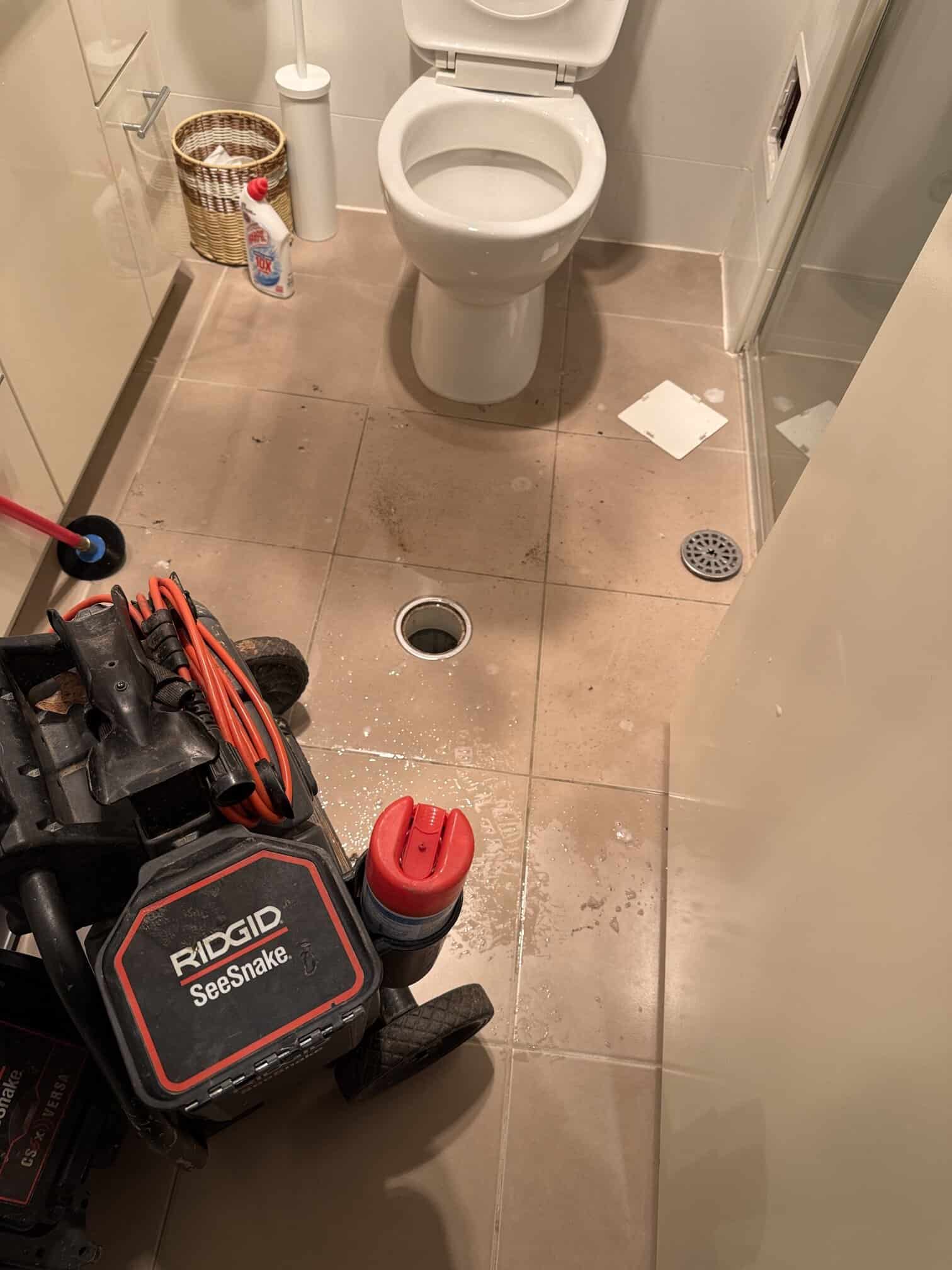 Toilet bowl holding wastewater from fully blocked internal sewer branch in Turner ACT.